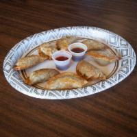 8 Piece Pot Stickers · Pan fried homemade pot stickers stuffed with ground pork and veggies. Crispy outside juicy i...
