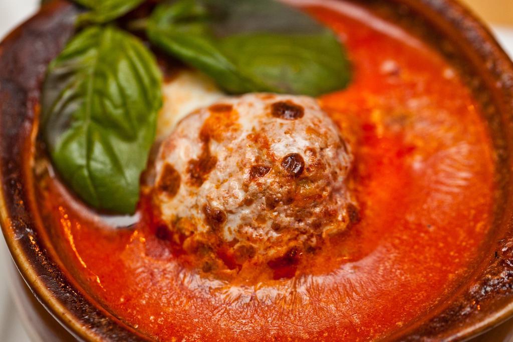 Polpette · Veal meatballs in tomato ragu.