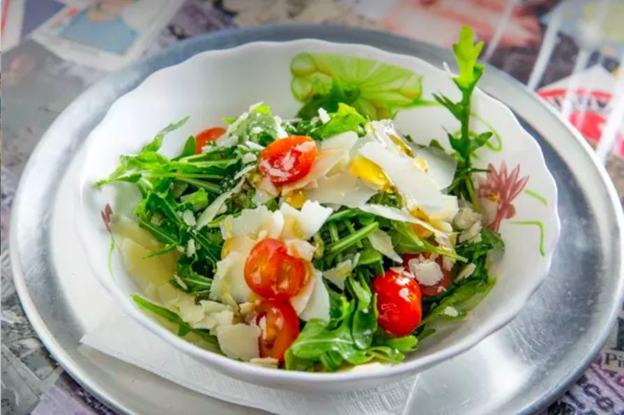 Rucola e Parmigiano Salad · Baby Arugula, cherry tomatoes, 24 month Shaved Parmigiano Reggiano, Black Olives balsamic vinaigrette