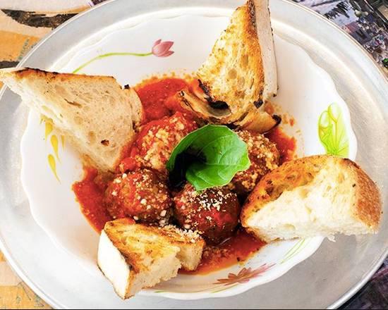 Meatballs Polpette · 100% beef meatballs in tomato ragu with parmigiano and basil, Served with Home Made Bread