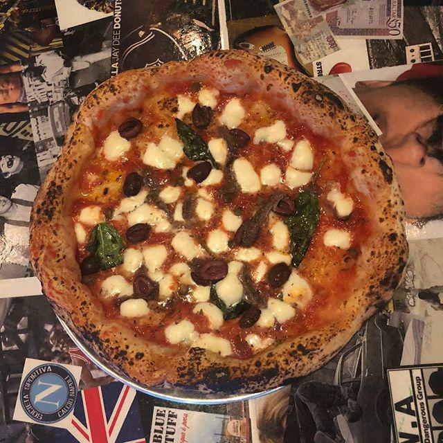 Napoletana Pizza · Tomato, mozzarella, anchovies capers, black olives, and oregano.