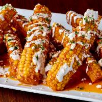 Picante Corn Ribs · 8 fried corn ribs covered with garlic tapitio glaze, queso fresco and chefs secret mayo. Top...