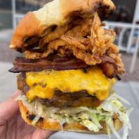 Croc Burger 2.0 · 2 Angus beef patties, fresno queso sauce, house smoked bacon, cheddar and american cheese, l...