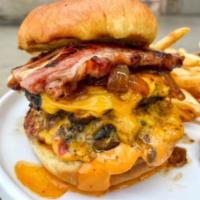 Jc's Absolute Melt · 2 Angus beef patties, sherry caramelized onion, house smoked bacon, chile aioli and american...