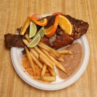 Mojarra · Fried whole fish, served with fries and side rice beans and corn or flour tortillas.