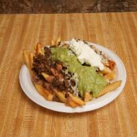 Papas con Carne · French fries topped with refried beans meat cheese guacamole sour cream 