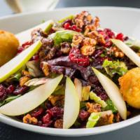 Pear & Goat Cheese Salad · Pear, mixed greens, goat cheese fritters, candied walnuts, dried cranberries, raspberry vina...