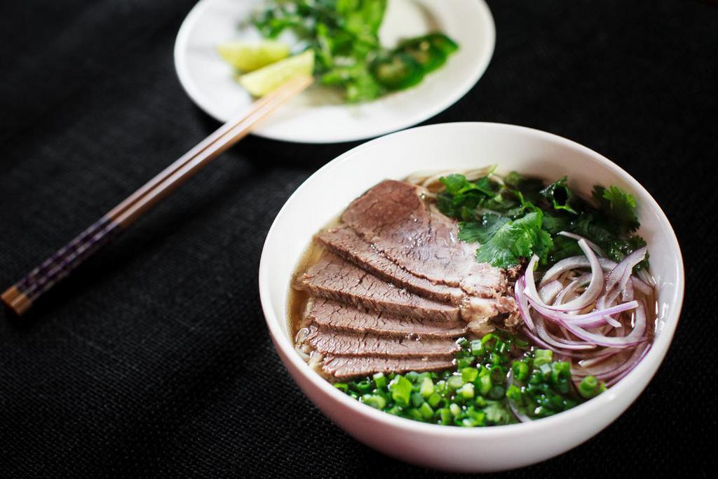 Smoked Beef Brisket Pho'  · smoked beef brisket, rice noodles, cilantro, scallions, red onion, our 8 hours house-made beef bone marrow broth, bean sprouts, Thai holy basil, lime, and pickled jalapeno. - gluten free