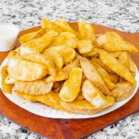 Potato Wedges · 1 lb of oven baked potato wedges comes with sauce on the side.