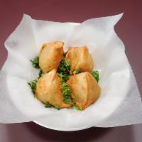 2 Piece Vegetable Samosa · Crispy patties stuffed with spices, potatoes and peas.