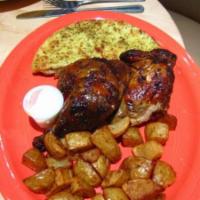 Half Rotisserie Chicken Meal · Whole chicken marinated in a zesty garlic lemon marinade, cooked in a rotisserie oven. Comes...
