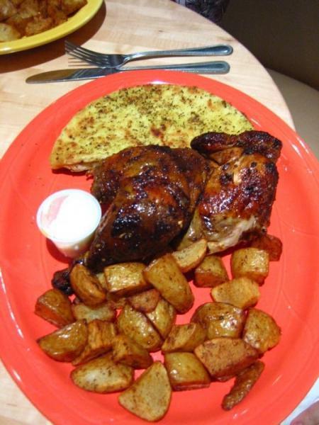 Half Rotisserie Chicken Meal · Whole chicken marinated in a zesty garlic lemon marinade, cooked in a rotisserie oven. Comes with salad and choice of side.