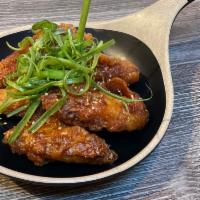 7. Korean Fried Chicken · 6 piece of Korean fried chicken wings and coated in sauce of choice.