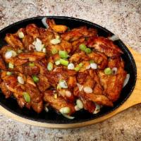 21. Yeontan Dweji Bulgogi · Thin sliced marinated pork with sweet sauce.