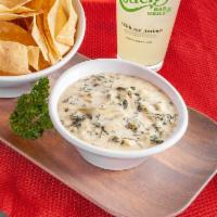 Four Cheese Spinach & Artichoke Dip · Parmesan, spinach, Swiss and cream cheese with a bowl of fresh tortilla chips. Served with o...