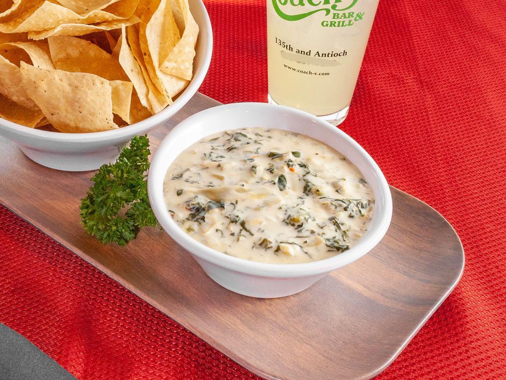 Four Cheese Spinach & Artichoke Dip · Parmesan, spinach, Swiss and cream cheese with a bowl of fresh tortilla chips. Served with our homemade salsa.