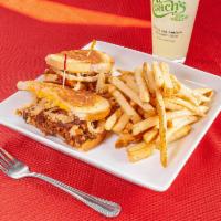 Piggy Melt · House smoked pulled pork with American, Swiss and cream cheese topped with onion straws and ...