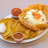 Taco Salad · In a flour tortilla bowl, your choice of meat with lettuce, pico de gallo, beans, cheese and...