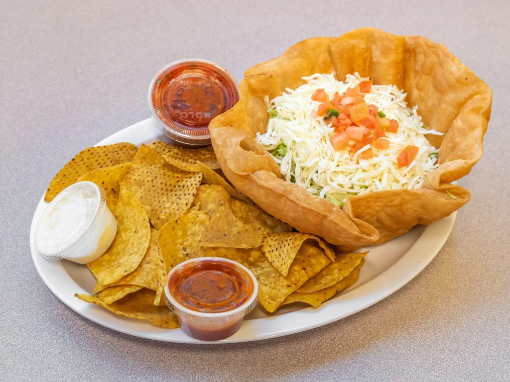 Taco Salad · In a flour tortilla bowl, your choice of meat with lettuce, pico de gallo, beans, cheese and corn tortilla chips with homemade Taco King dressing on the side.
