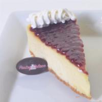 Cheesecake · Cheesecake topped with whipped cream.