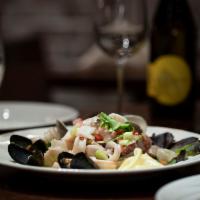Seafood Salad · Shrimp, clams, calamari and mussels in a lemon, celery, garlic and olive oil dressing.