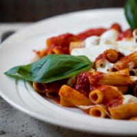 Pasta Caprese · Plum tomato and basil sauce with diced fresh mozzarella.