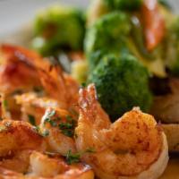 Shrimp Scampi (8) · Shrimp sauteed in garlic, olive oil and white wine. Served with potato and vegetable of the ...