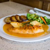 Salmone · Broiled salmon with lemon, white wine and artichoke hearts. Served with potato and vegetable...