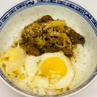 Gyudon · Thinly sliced beef & onions simmered in mildly sweet sauce flavored with dashi, soy sauce & ...
