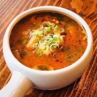 Tom Yum Soup · Thai spicy soup served with shrimp or chicken, mushroom, tomato and topped with scallion and...