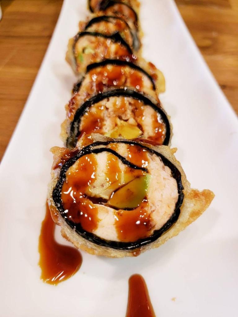 6 Pieces Salmon Tempura Maki · Deep fried inside out roll salmon with avocado, crab stick and eel sauce.