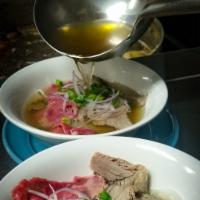 Pho - Rice Noodle Soup · House made savory vietnamese  beef broth, served with your choice of proteins, rice noodles,...