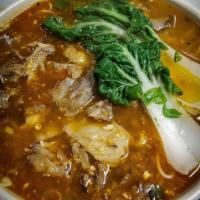 Spicy Wicked Noodle Soup · Wok tossed pork belly and oxtail in our housemade garlic chili sauce. Served over rice
noodl...
