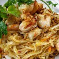 Shrimp Pad Thai Noodles · Wok tossed rice noodles in a sweet and tangy tamarind sauce with bean sprouts, carrots and o...