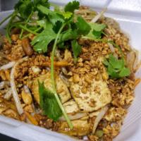 Tofu Pad Thai Noodles · Wok tossed rice noodles in a sweet and tangy tamarind sauce with bean sprouts, carrots and o...