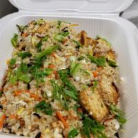 Chicken Fried Rice · Thai Jasmine rice wok tossed with fresh vegetables , egg and your choice of meats. Topped wi...