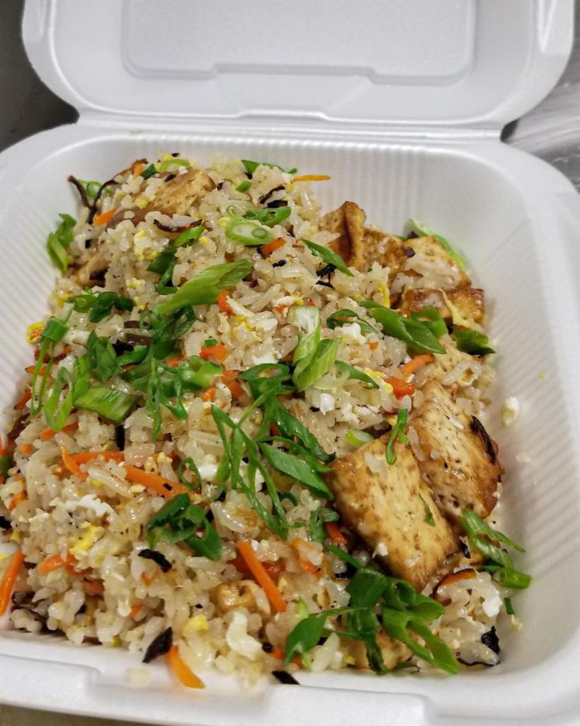 Chicken Fried Rice · Thai Jasmine rice wok tossed with fresh vegetables , egg and your choice of meats. Topped with green onions 