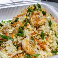 Shrimp Fried Rice · Thai Jasmine rice wok tossed with fresh vegetables , egg and your choice of meats. Topped wi...