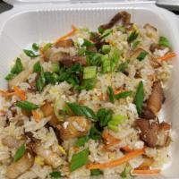 Porkbelly Fried Rice · Thai Jasmine rice wok tossed with fresh vegetables , egg and your choice of meats. Topped wi...