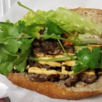 Beef Sandwich · Toasted baguette with fresh and pickled vegetables, vietnamese bbq charbroiled meats topped ...