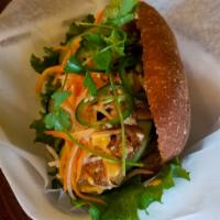 Chicken Sandwich · Toasted baguette with fresh and pickled vegetables, vietnamese bbq charbroiled meats topped ...