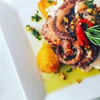 Polvo 10 Rocks · Grilled tender octopus over fried plantain, topped with a garlic and fresh cilantro infused ...