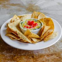 Spinach Dip · Garlic and cheese spinach dip, cheddar, tomato, and tortilla chips. Vegetarian. Gluten free.