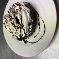 Chocolate Truffle · Dense flourless chocolate cake. Served with whipped cream. Gluten free.