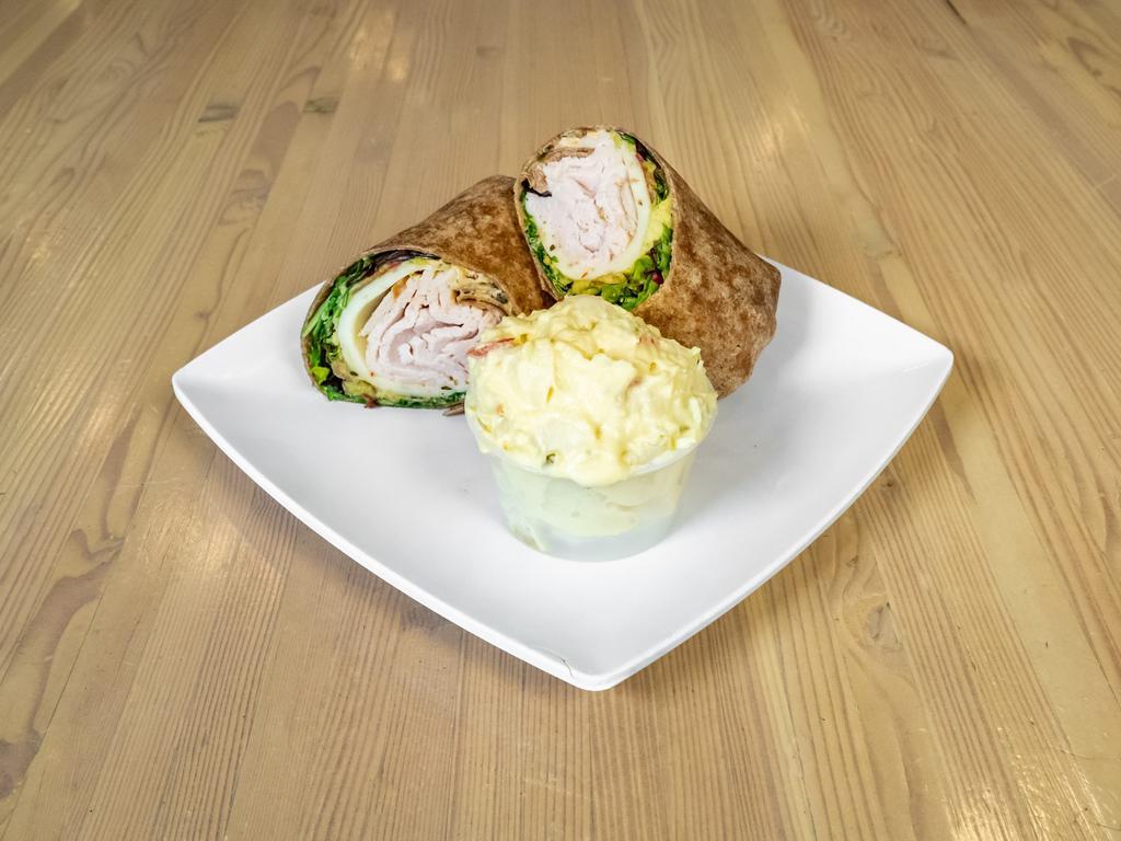 Southwest Turkey Wrap · Turkey, bacon, pepper jack cheese, guacamole, lettuce, and spicy ranch dressing served on a honey wheat wrap. Comes with a choice of blueberry slaw, potato salad or chips.