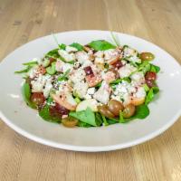 Spinach Waldorf Salad · Chicken, feta cheese, grapes, celery, apples, and pecans on a bed of crisp hearty spinach. S...