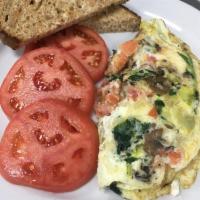 Healthy Omelet · Egg whites with tomato, onions, mushrooms, spinach and feta cheese served with a side of sli...