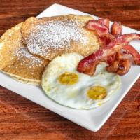 Pancake Platter · 2 buttermilk pancake, 2 eggs and choice of sausage, Canadian bacon, bacon, ham or chicken ap...