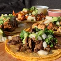 Street Taco    · Corn or Flour Tortillas, Choice of Meat or Veggie, Topped with Onion, Cilantro and Guac