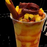 Mango Attack (Mangoneada) · Blended mango, cane sugar, mango chunks, cocktail peanuts, chamoy, tajin, tamarind stick, fr...